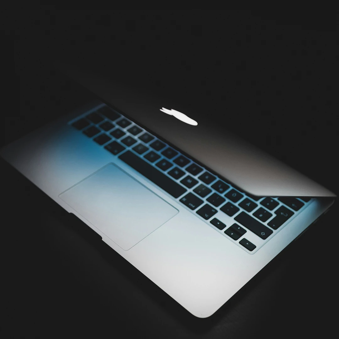 Silver laptop on a dark background