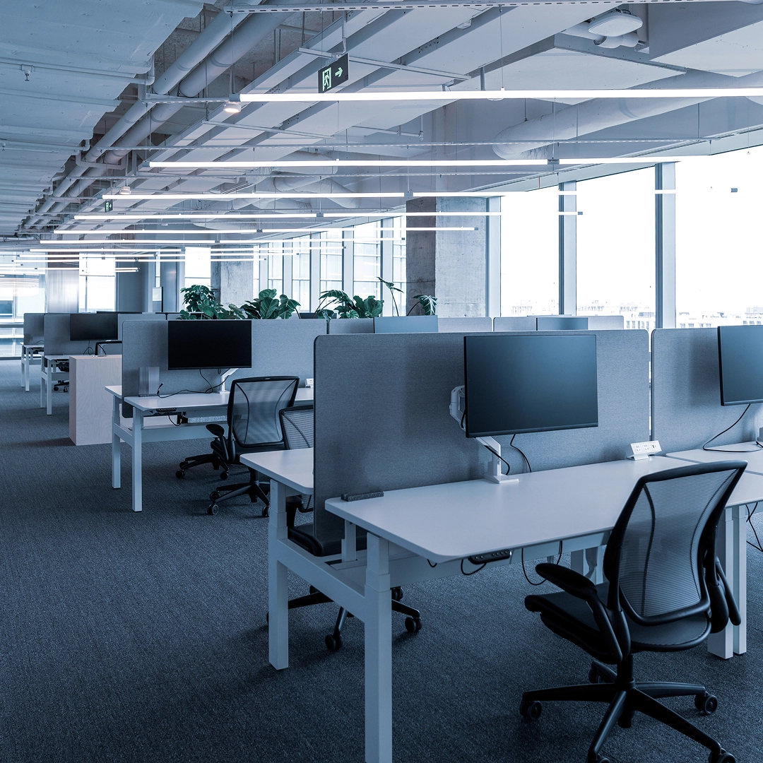 Bright and spacious modern call center office with ergonomic workstations and open layout design