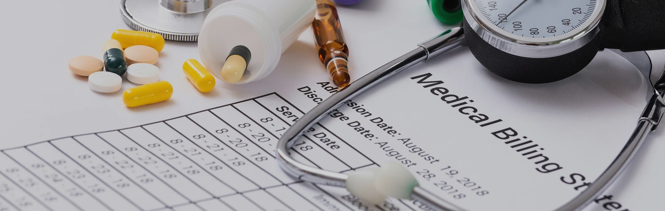 Medical billing statement with stethoscope and medication.