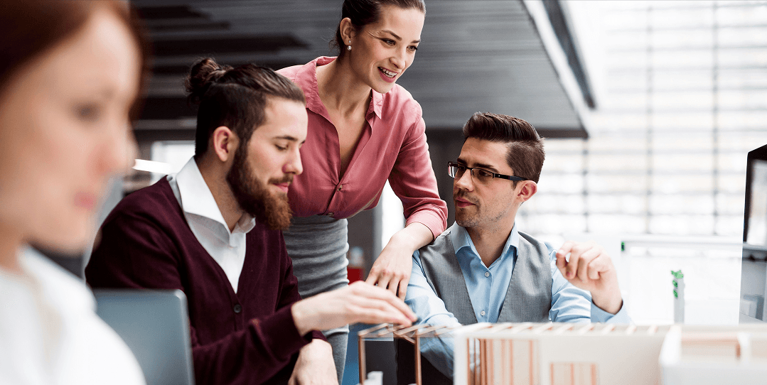 Group of colleagues working together around a table