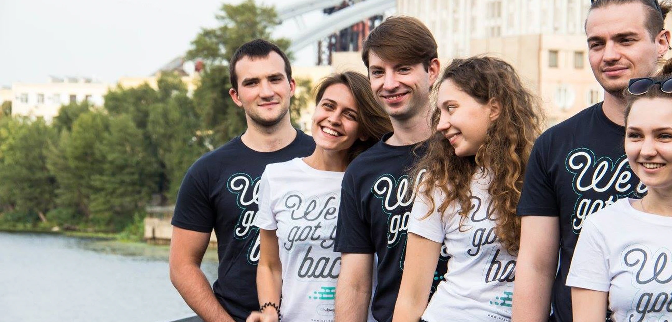 Group photo of smiling Helpware team members