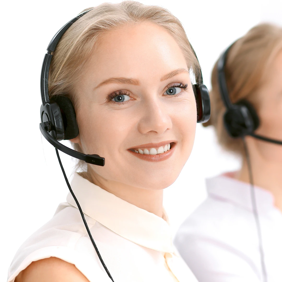 Friendly blonde female customer support representative wearing a white blouse and a headset