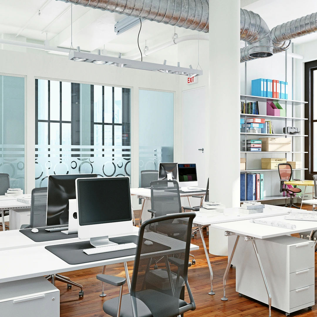 Clean and organized office space with desks, computers, and filing cabinets in a Houston call center