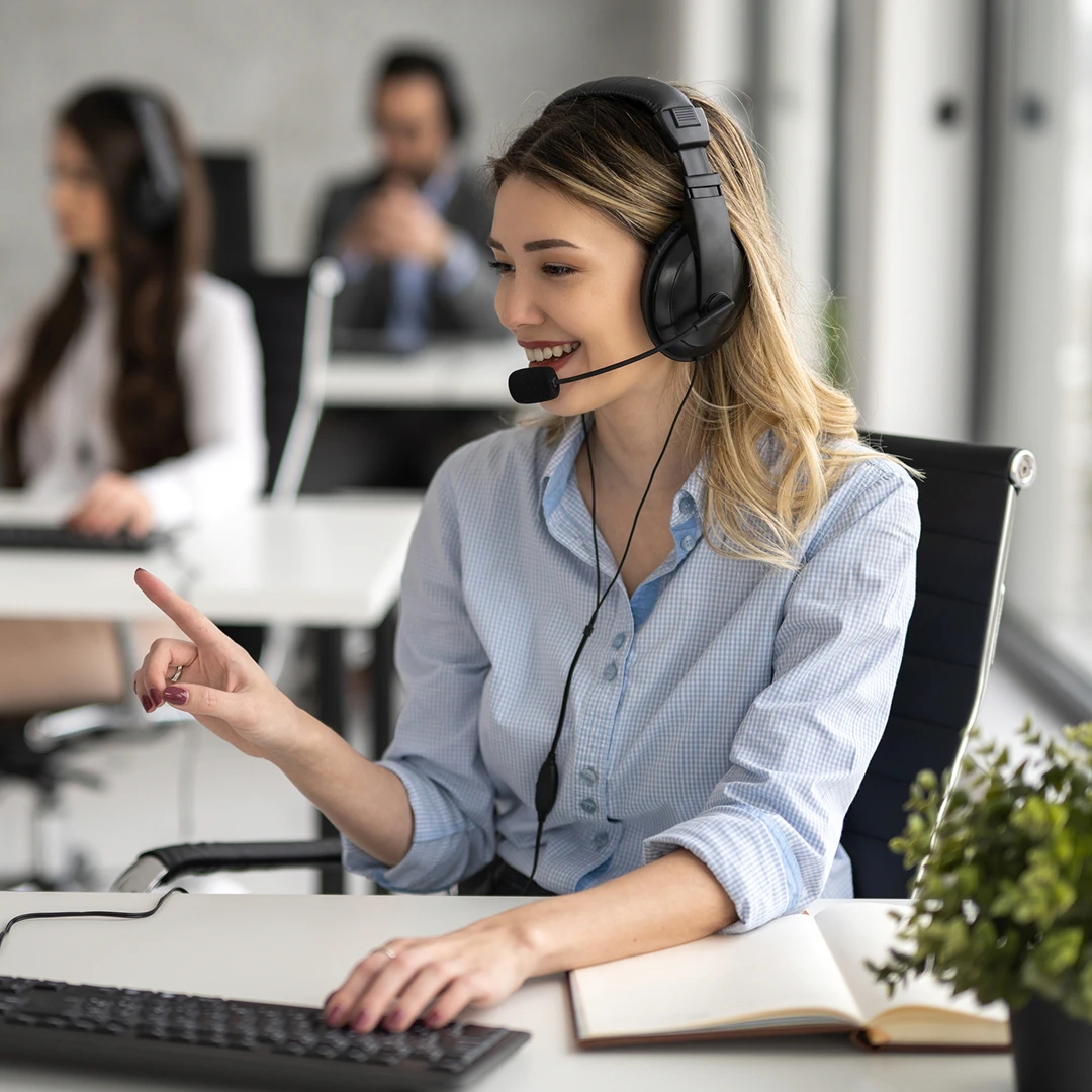 Happy woman working as a customer support agent in a call center in Ukraine
