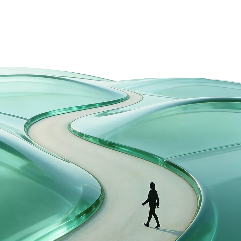 Person walking down a winding path through green hills