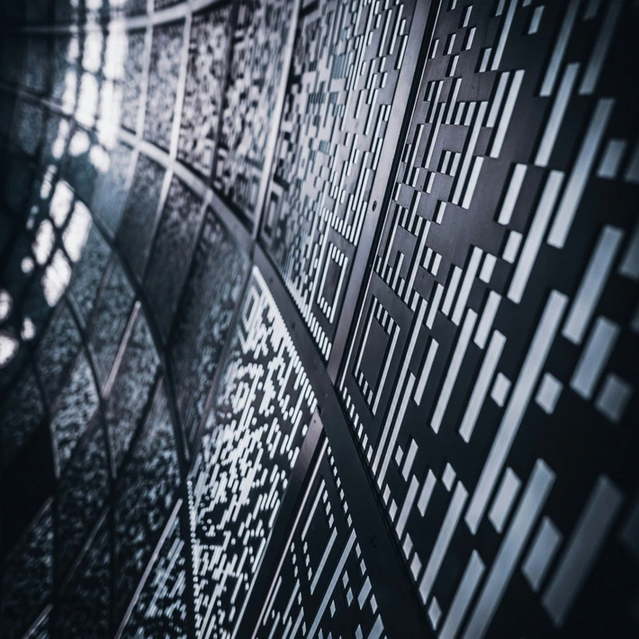 some sort of wall with QR codes, gives interstellar vibes