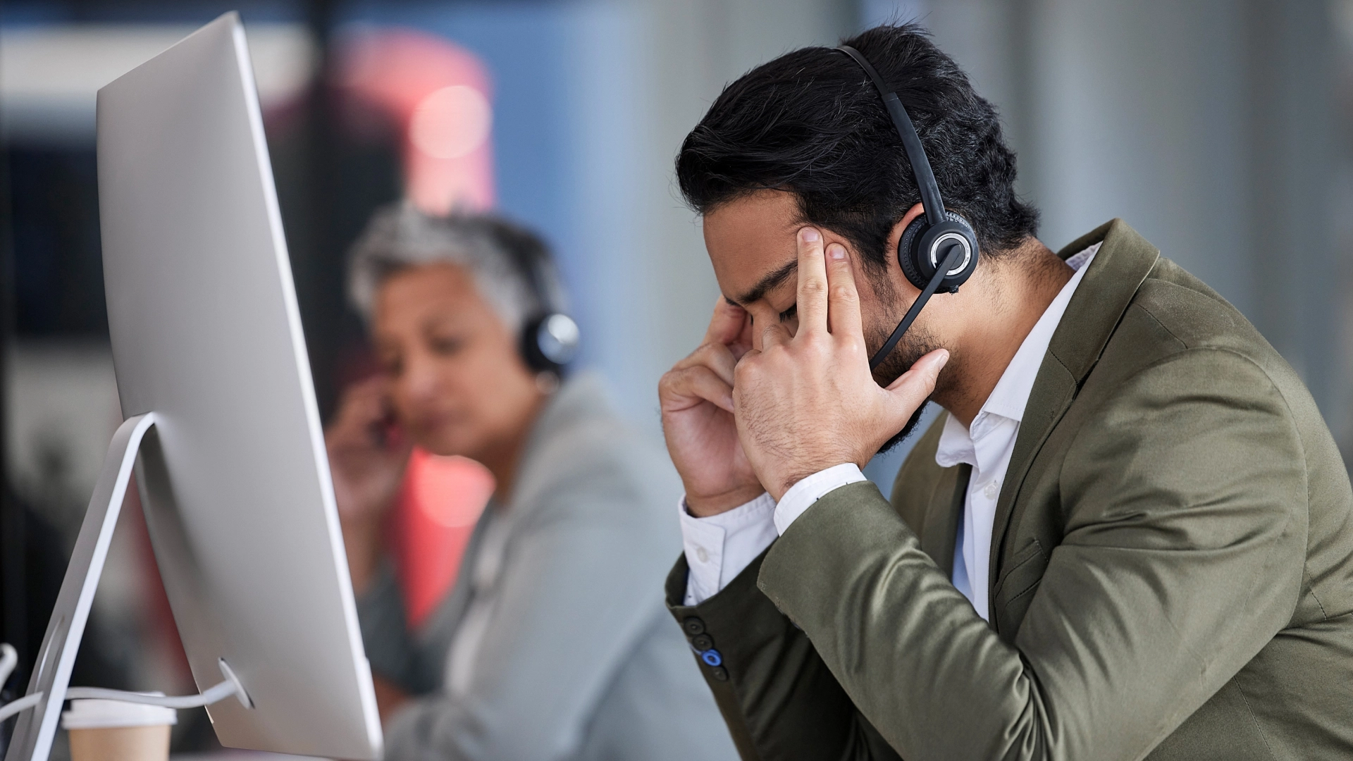 Call center agent experiences the pressure and stress of the job.