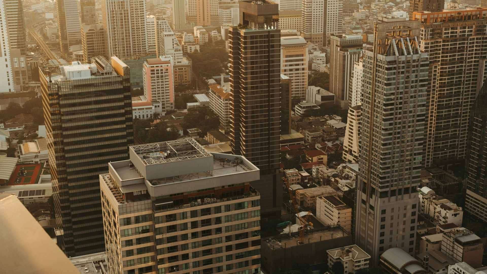 Manila skyline at sunset, showcasing the modern architecture of the Philippines.