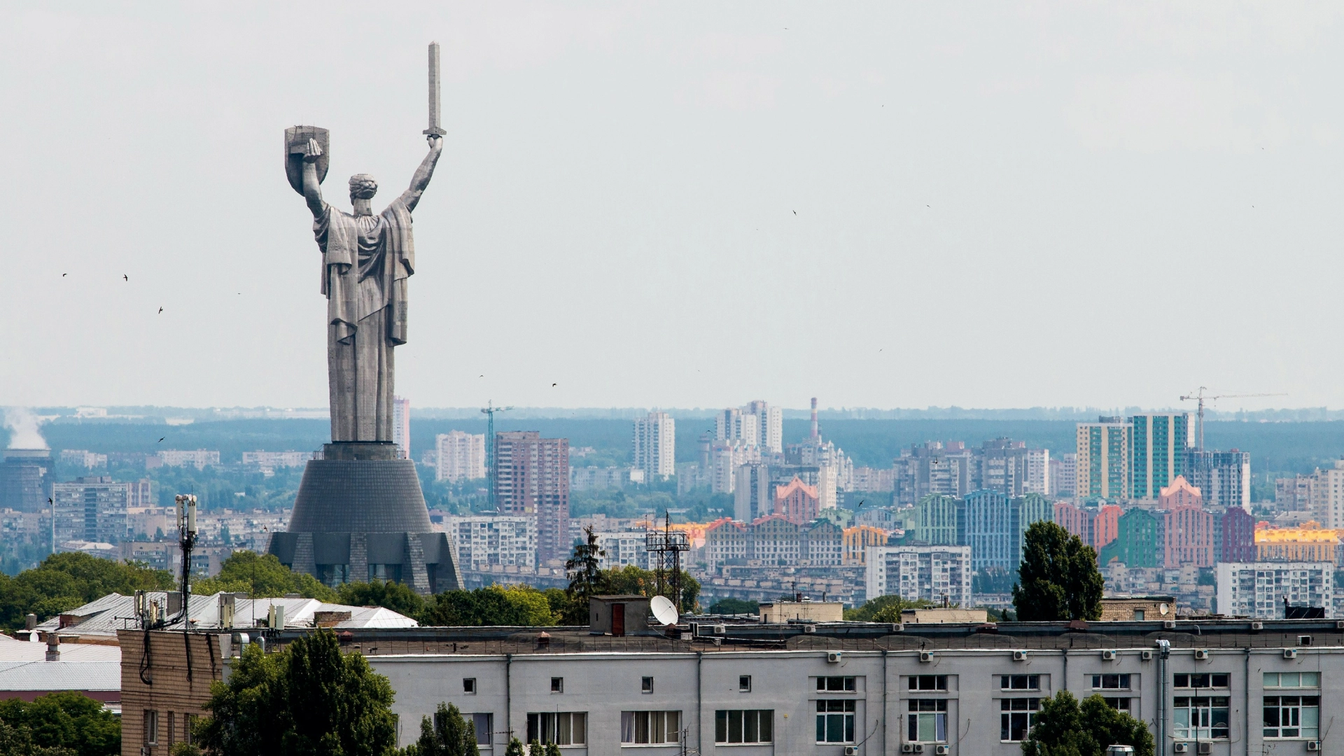 Panorama of Kyiv, Ukraine, dominated by the Motherland Monument statue.