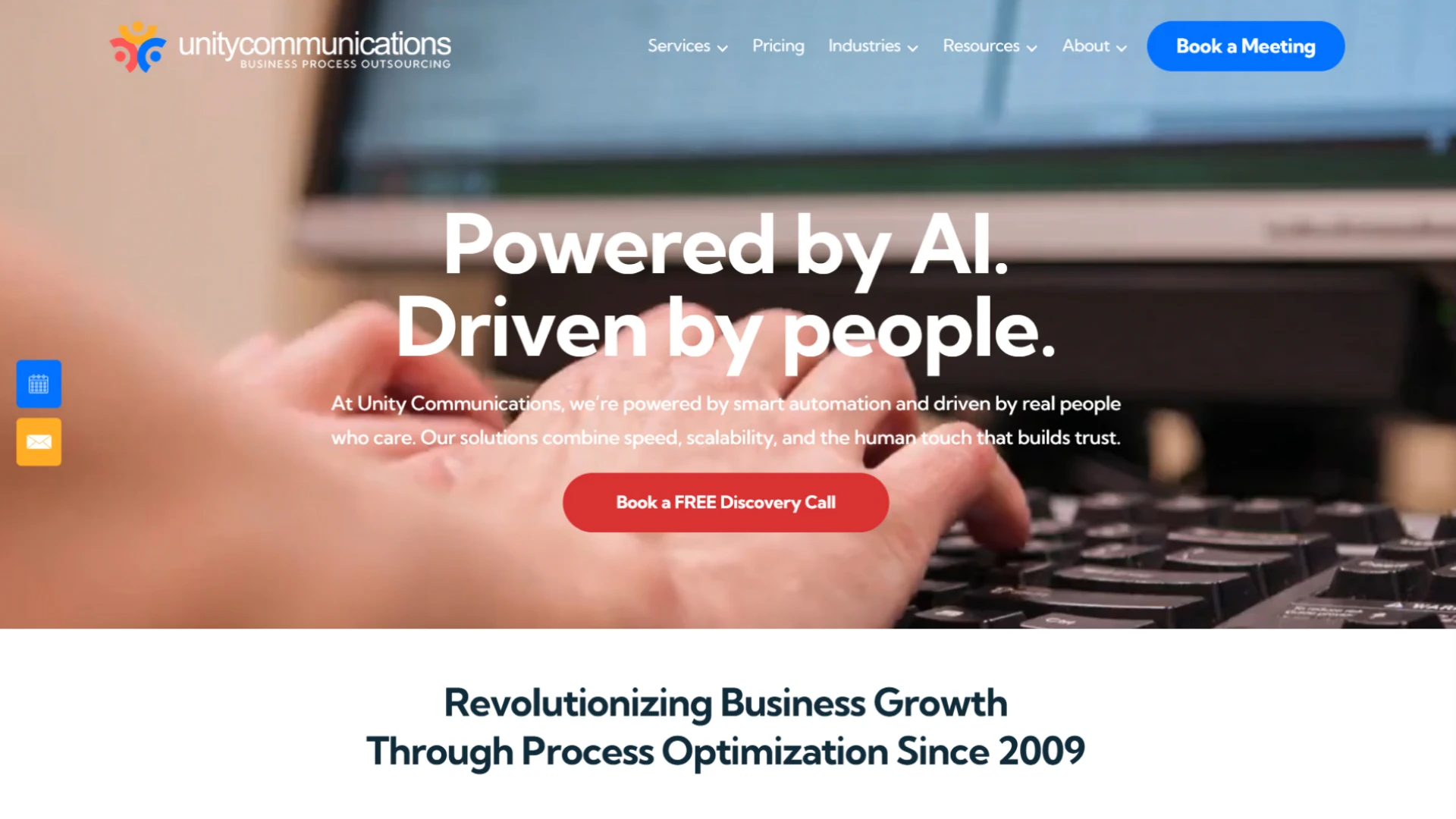 Unity Communications website homepage featuring a close-up of hands typing on a keyboard and the tagline 'Powered by AI. Driven by people.' Call to action to book a free discovery call.
