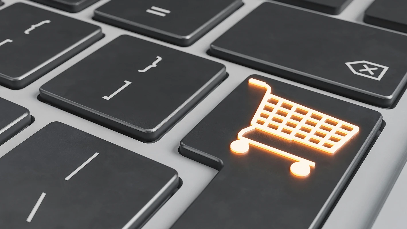 Close-up of a keyboard with a shopping cart icon on one of the keys